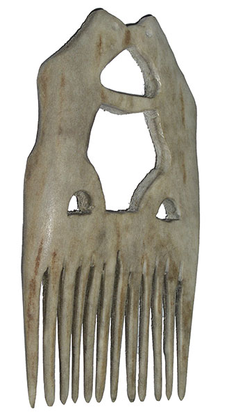 Twelve-toothed bone comb. It is more or less rectangular in shape. Two animals are sculpted on the top part - these appear to be two standing bears facing each other, with their arms and snouts touching each other. This stance could suggest a confrontation OR affection because they look as if they are kissing. 